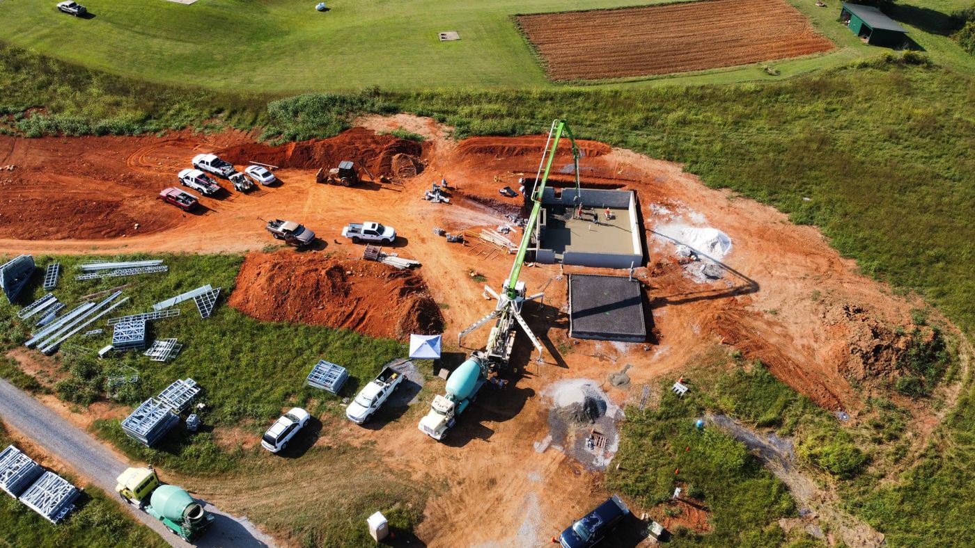 Concrete pump placing a foundation pour