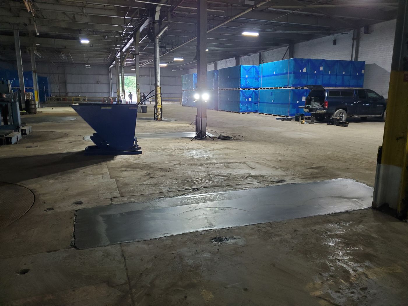 Restored slab section inside an operating warehouse